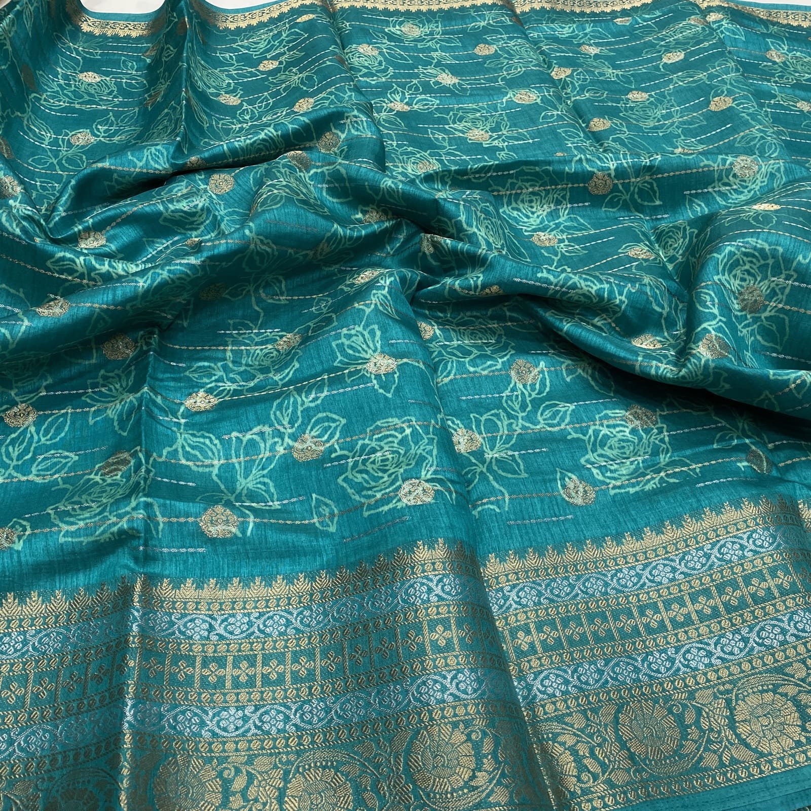 Dola Tussar Semi Saree in Rama Blue with Floral Emboss Design