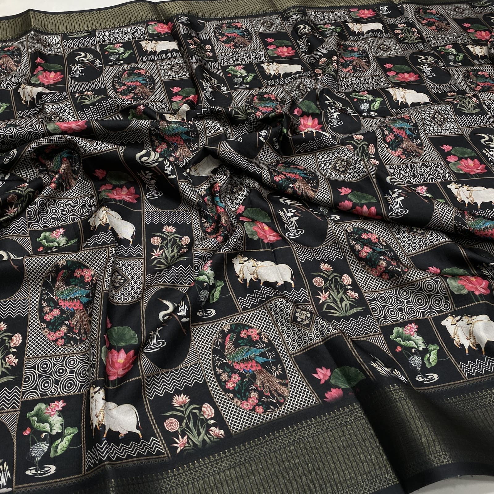 Black raw dola silk pichwai print saree with peacock, flower and cow design