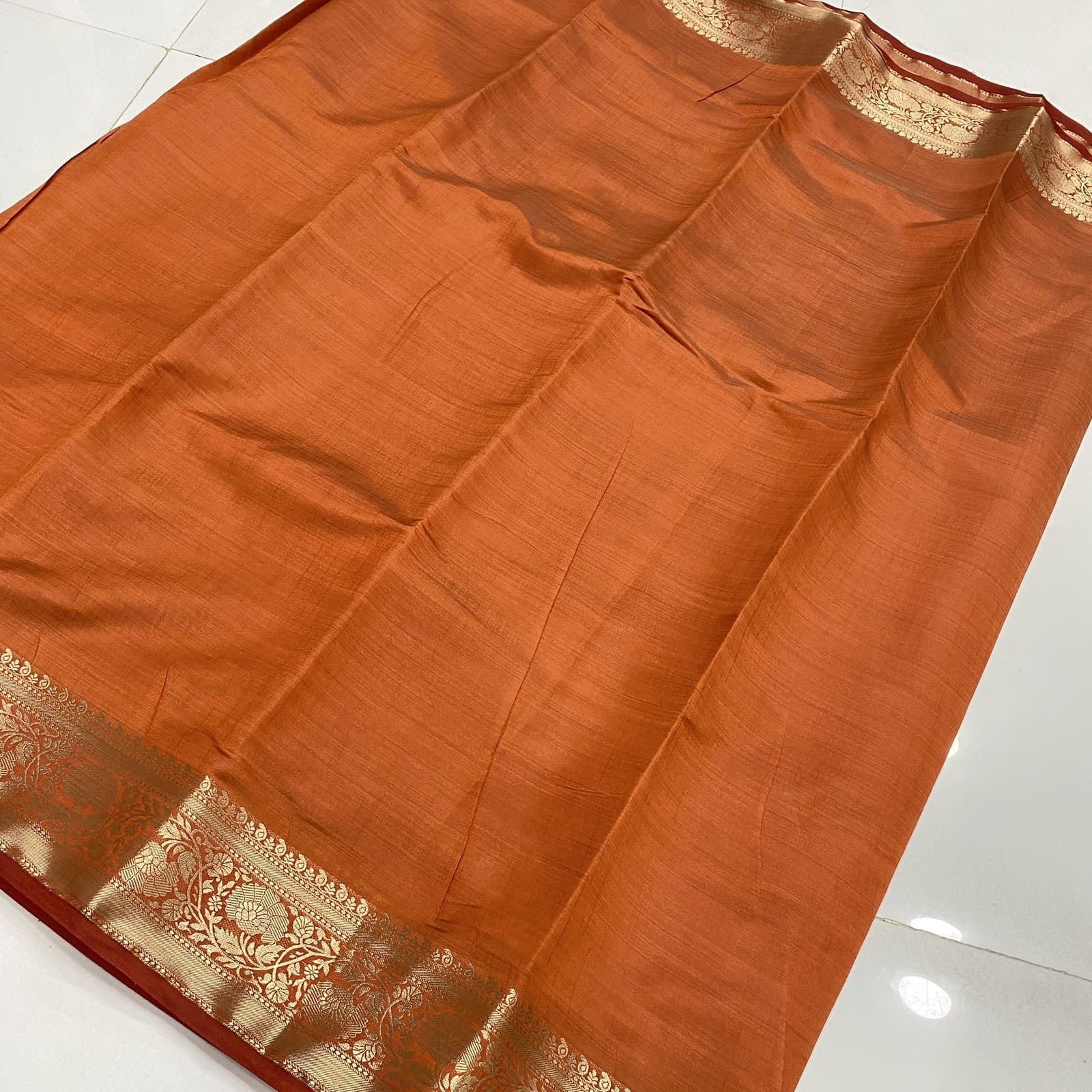 Raw Silk Saree in Orange with Floral Zari Border