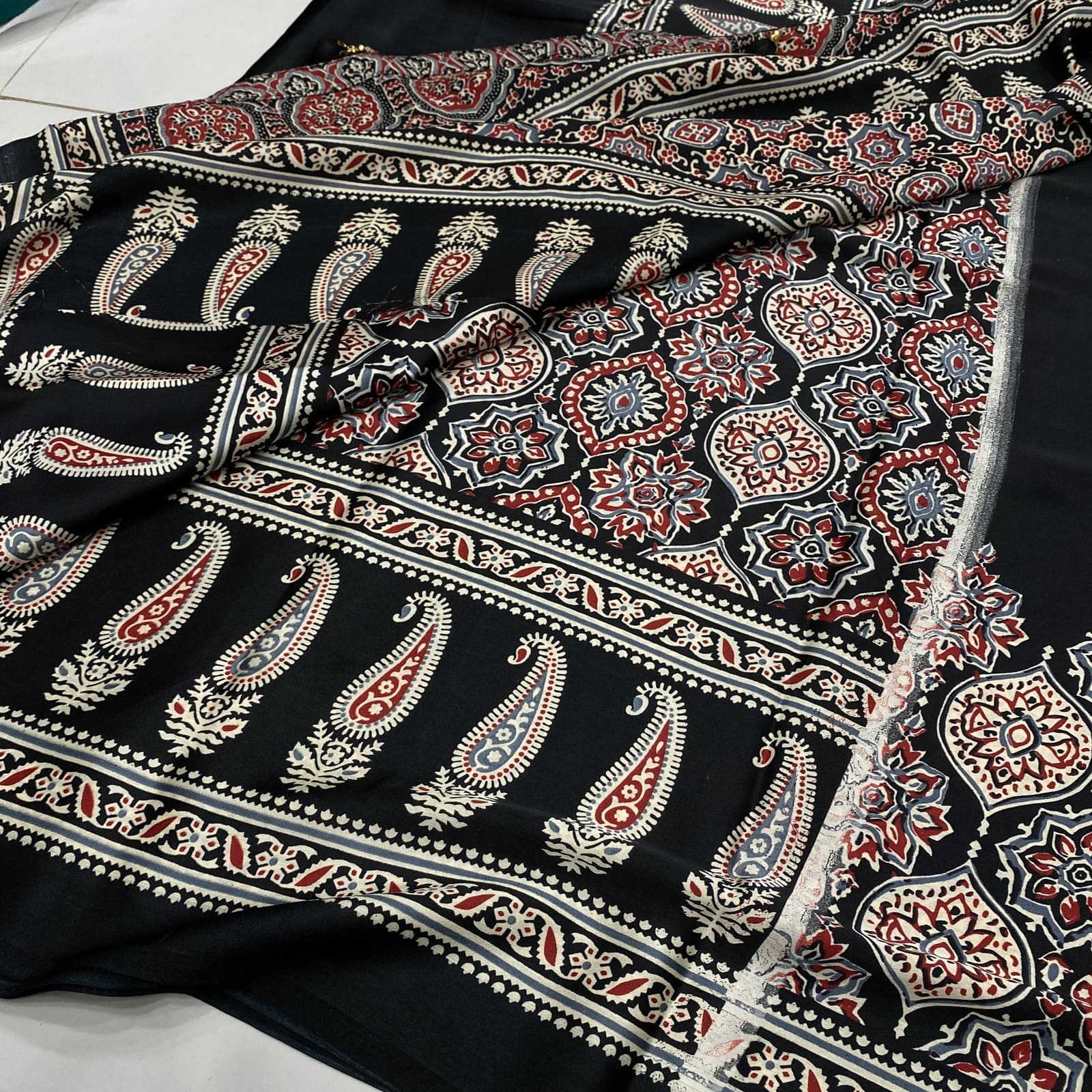 Matching ajrak print blouse for black satin finish saree