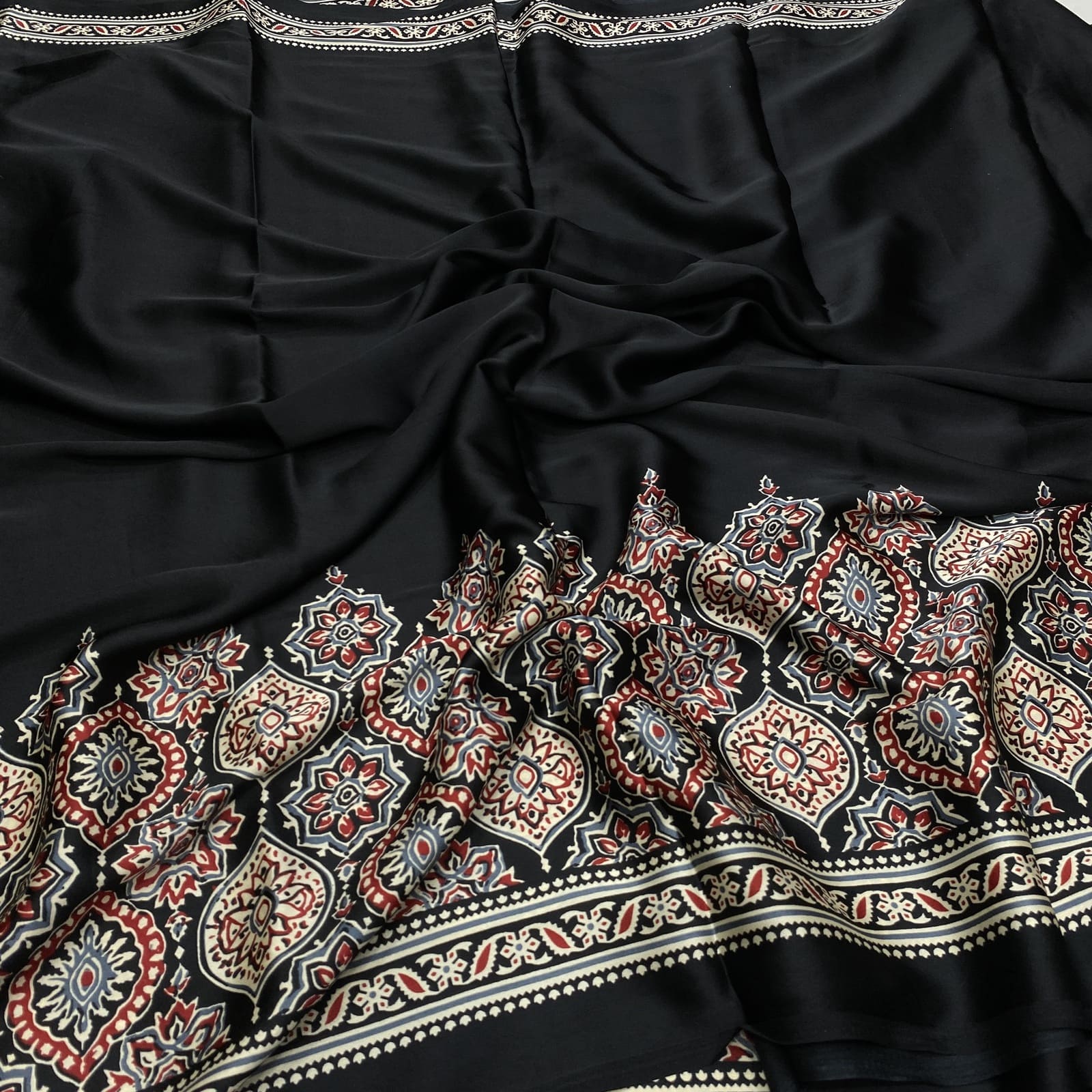 Black satin finish print saree with ajrak design border