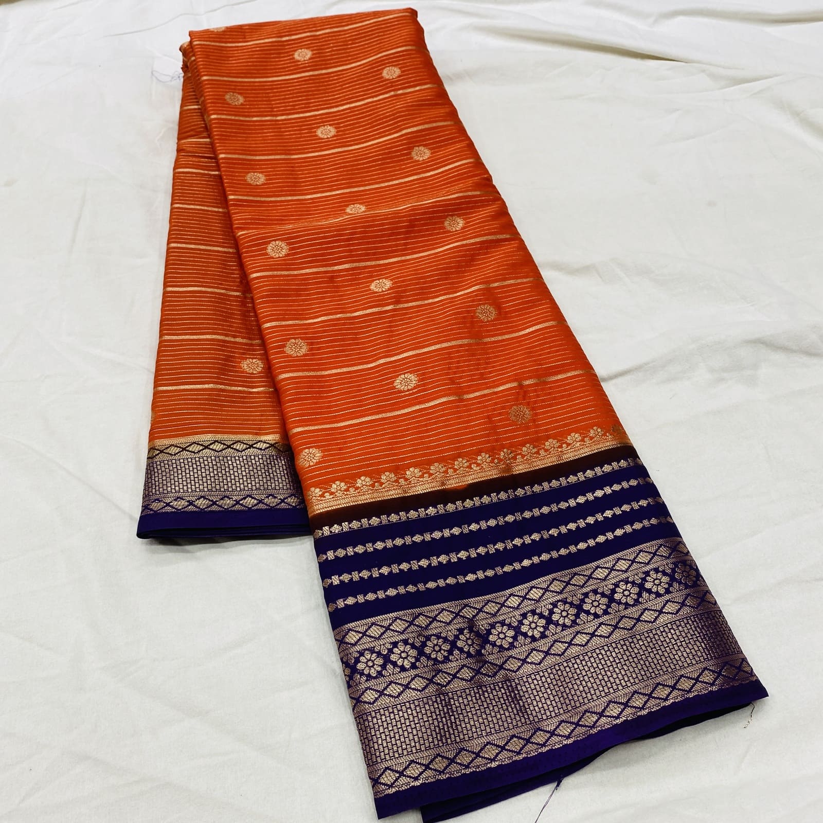 Matching contrast blouse for orange with purple semi Mysore silk saree folded pic