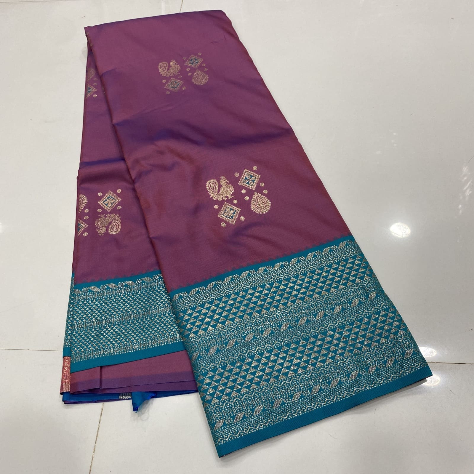 Semi Silk Saree in Wine with Teal featuring Annam Rangoli Deepam Butta Design