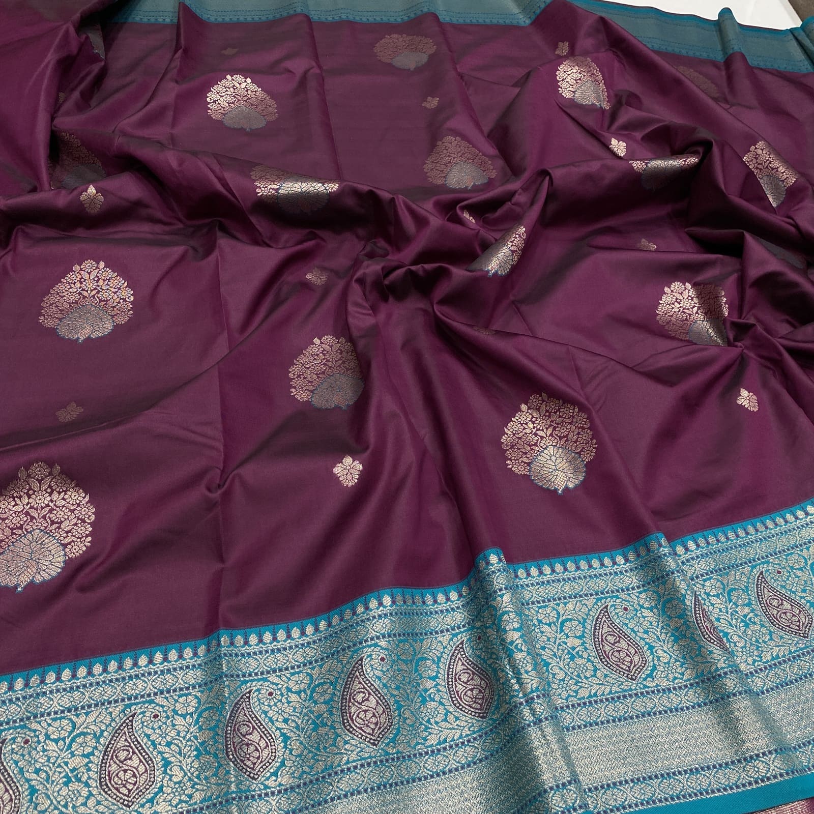 Semi Silk Saree in Wine with Rama Blue Border featuring Butta Design