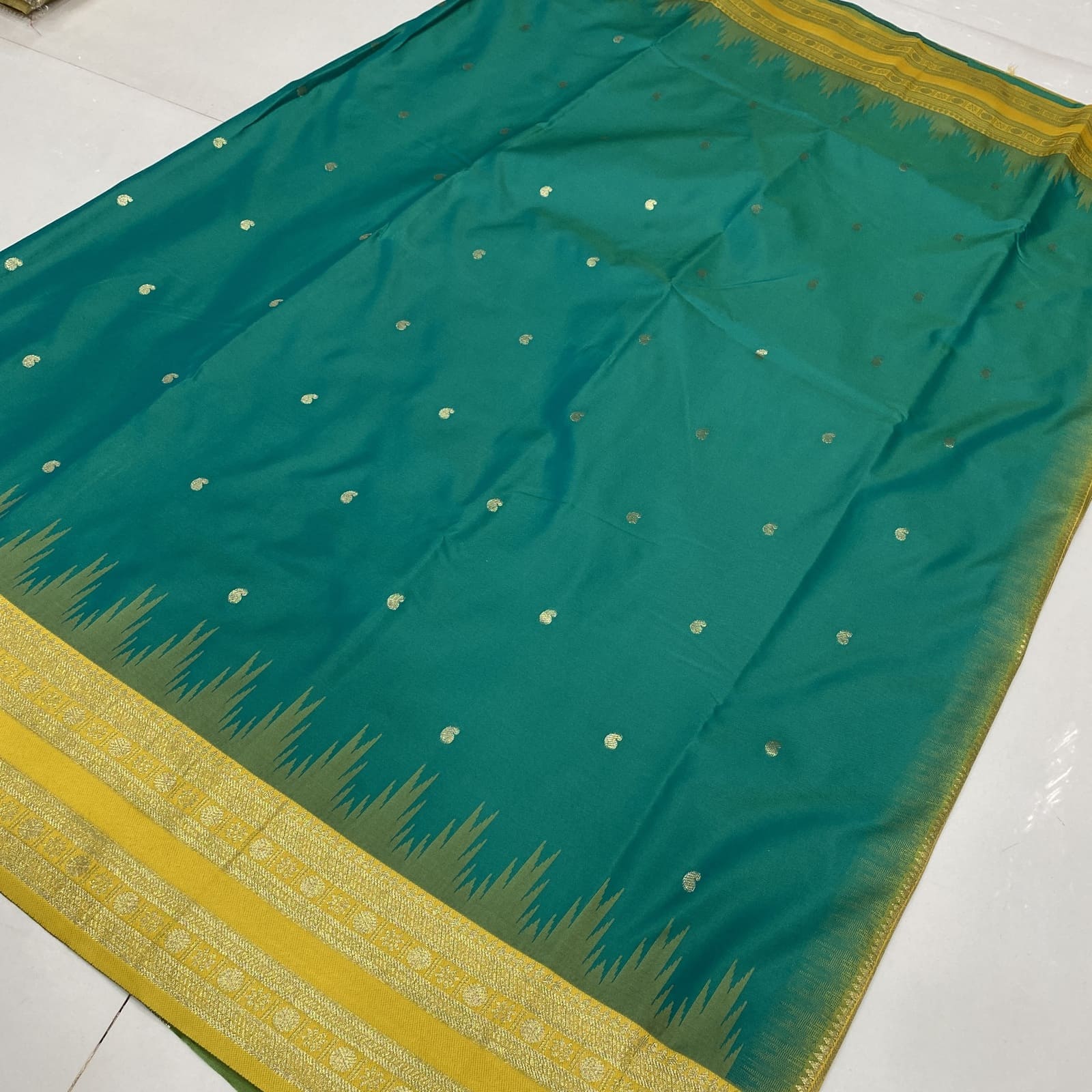 Semi Silk Saree in Rama Green with Yellow featuring Mango Leaf Zari Butta