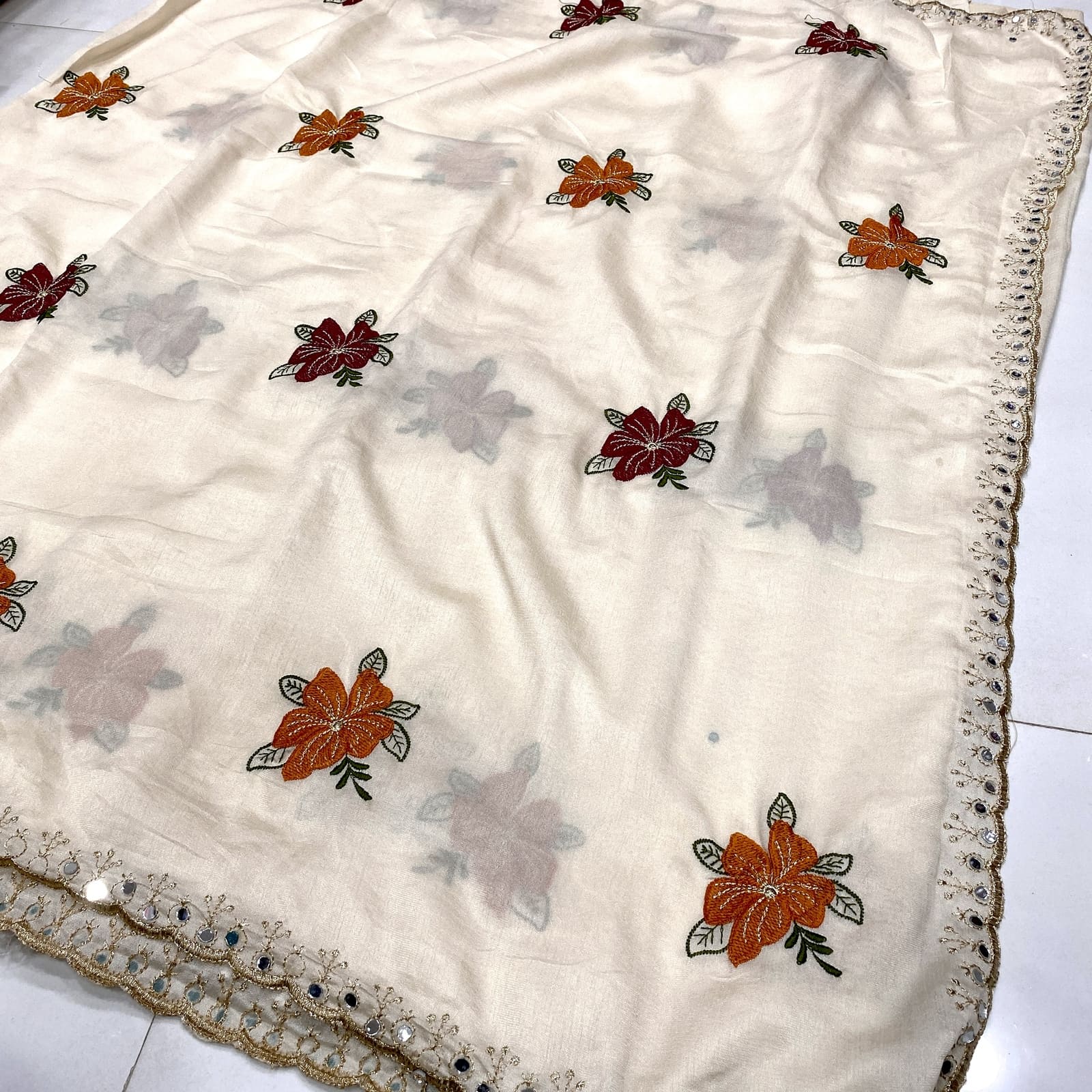 Beige tussar chiffon saree rich floral embroidery pallu with faux mirror detailing