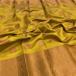 Yellow tussar silk saree with peacock copper butta and waves kanchi border