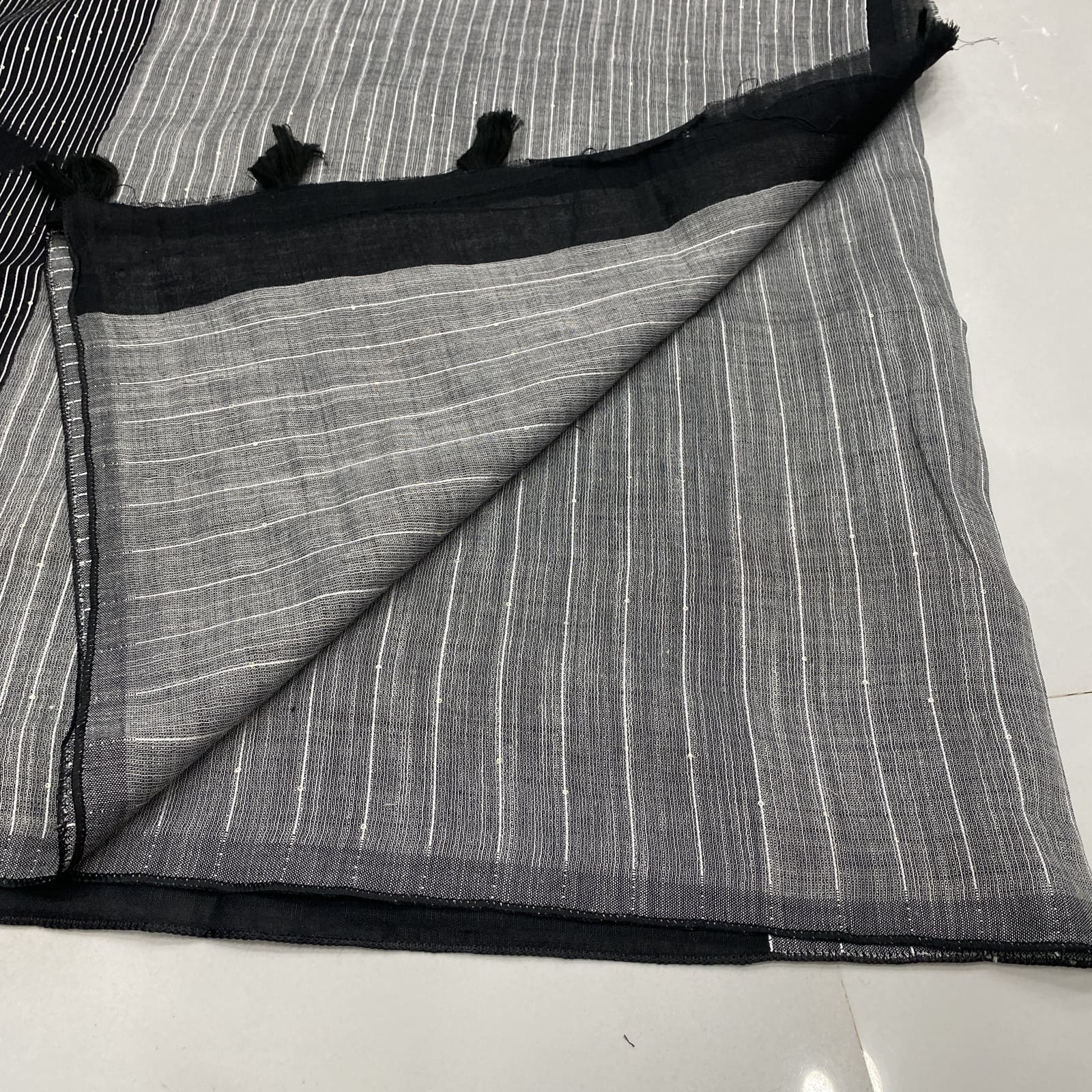 Matching black blouse piece for linen saree