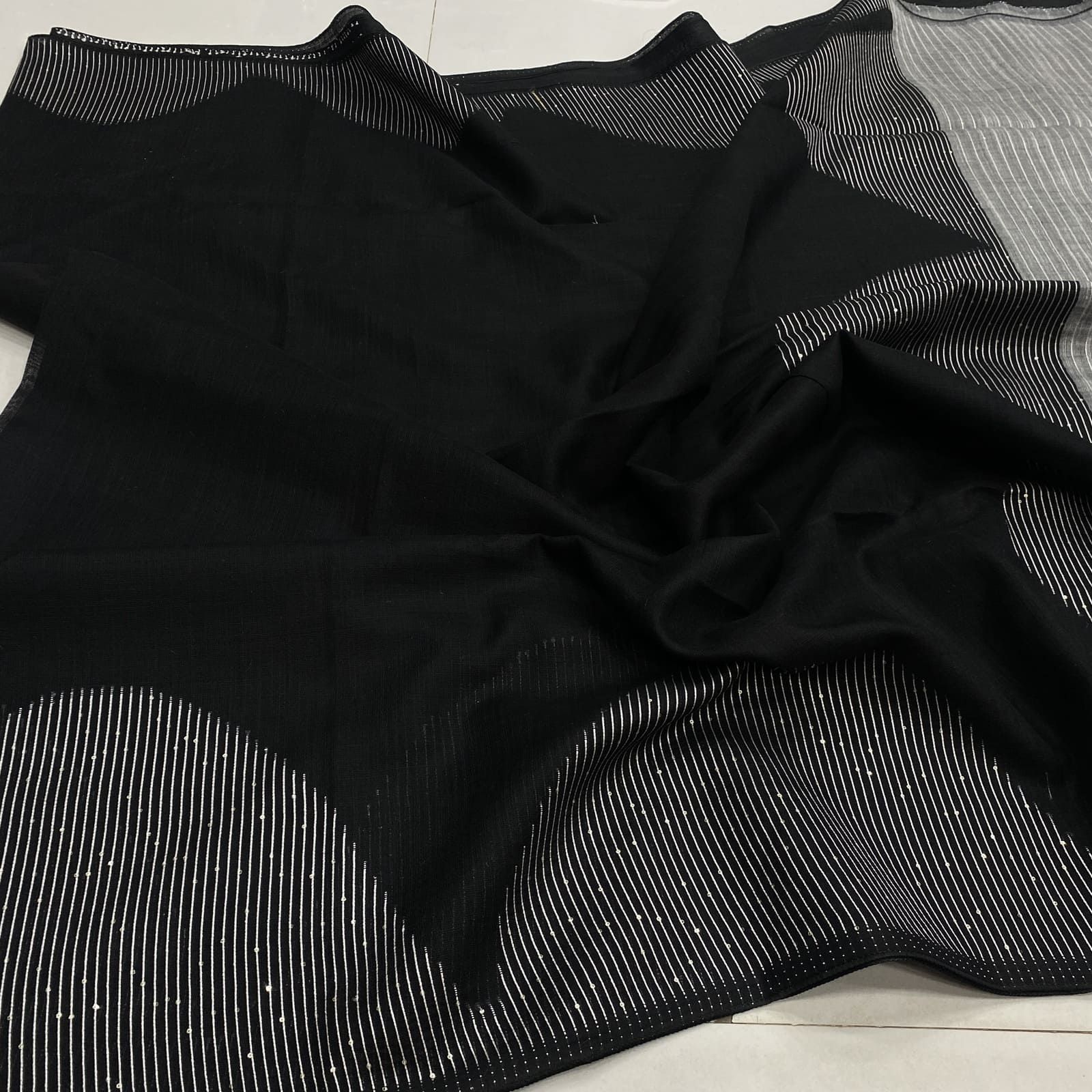 Black linen saree with geometric arc sequins border and striped pallu