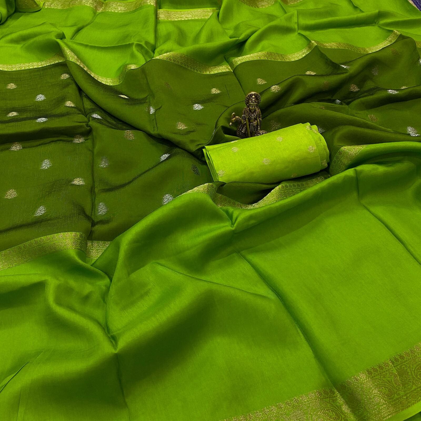 Green pure viscose crepe silk saree with mid weave butta design