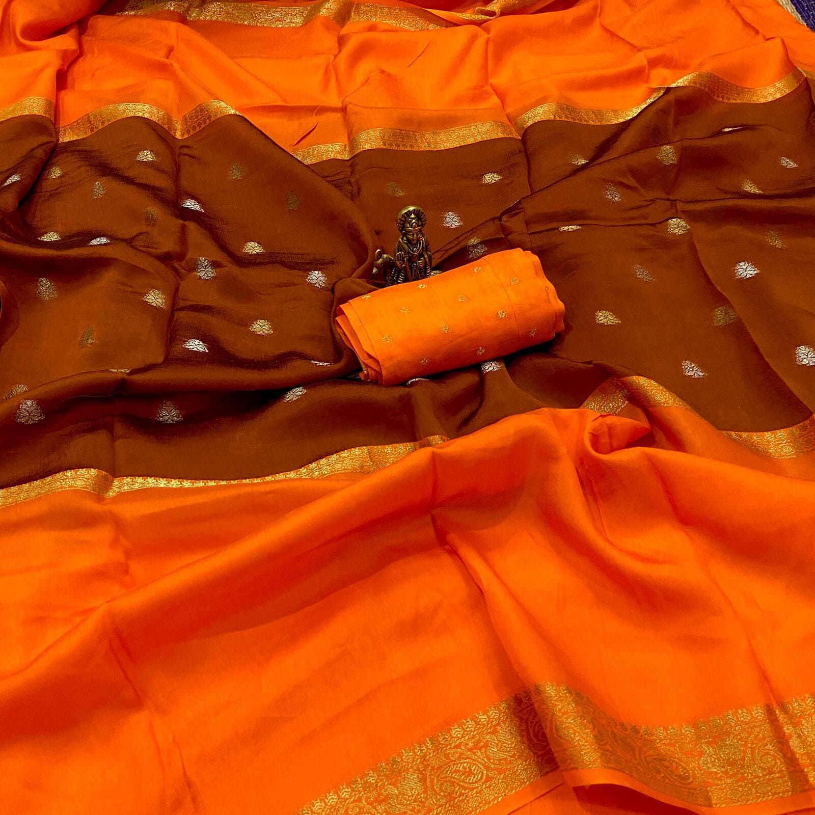 Orange pure viscose crepe silk saree with mid weave butta design