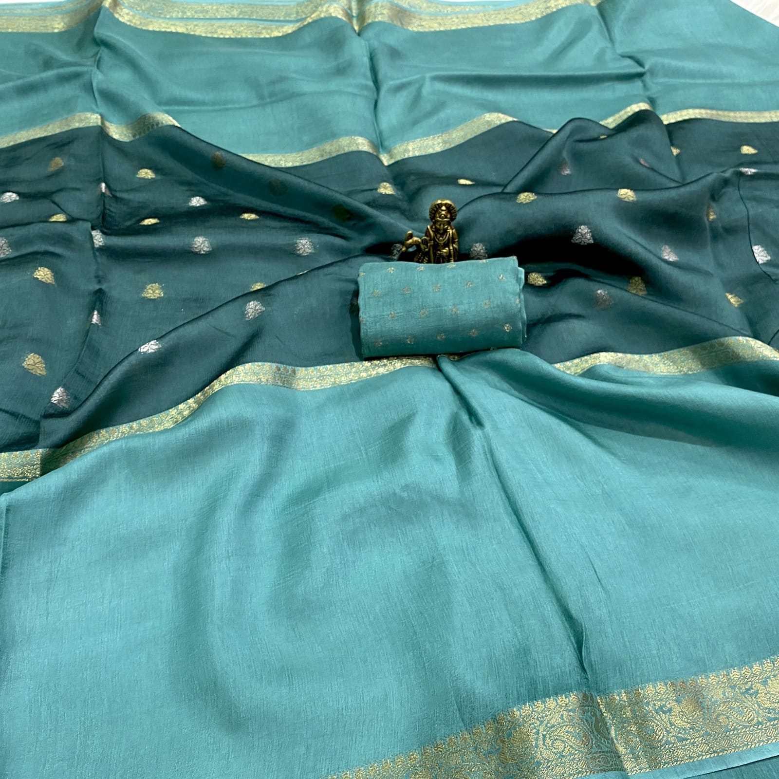 Rama blue pure viscose crepe silk saree with mid weave butta design