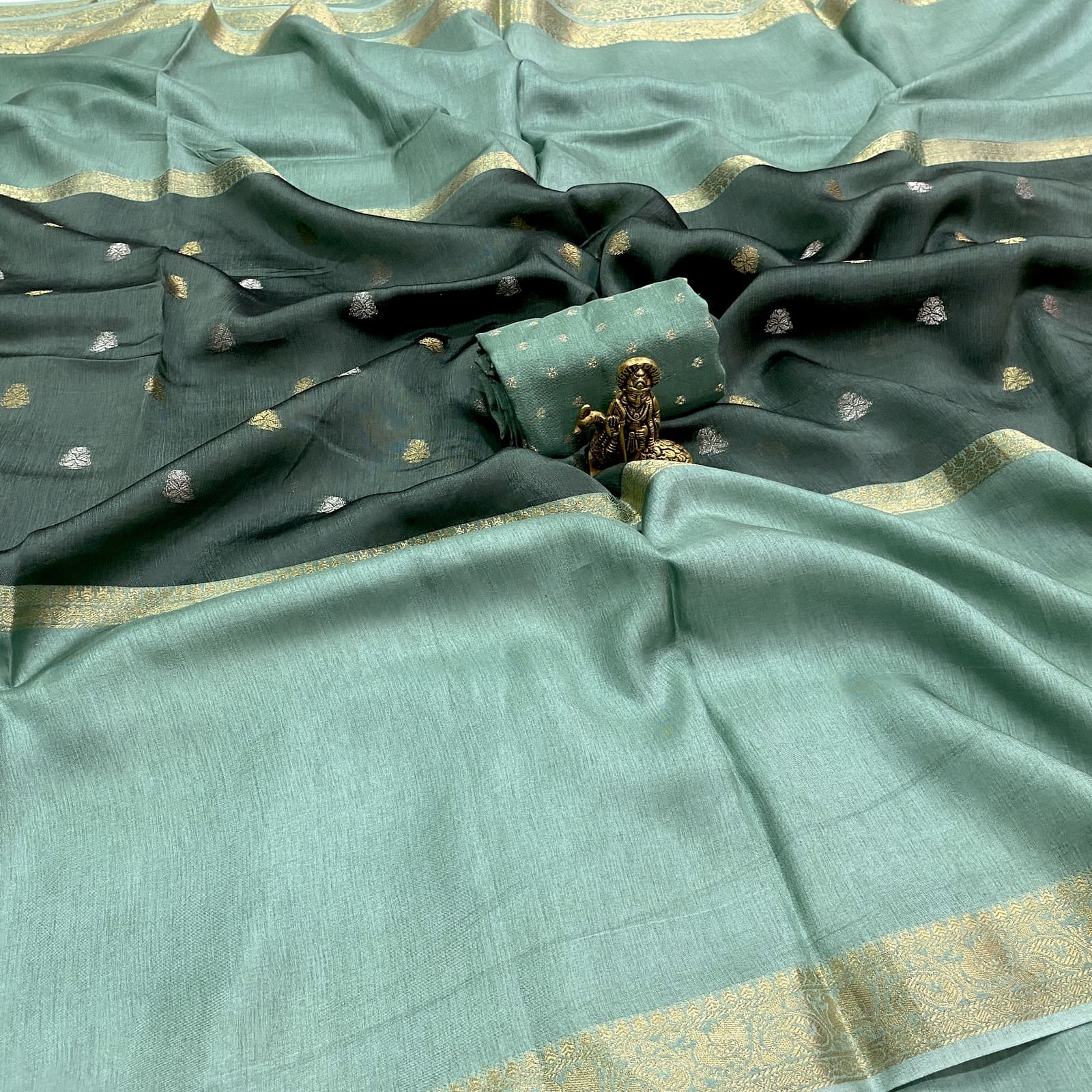 Sea green pure viscose crepe silk saree with mid weave butta design