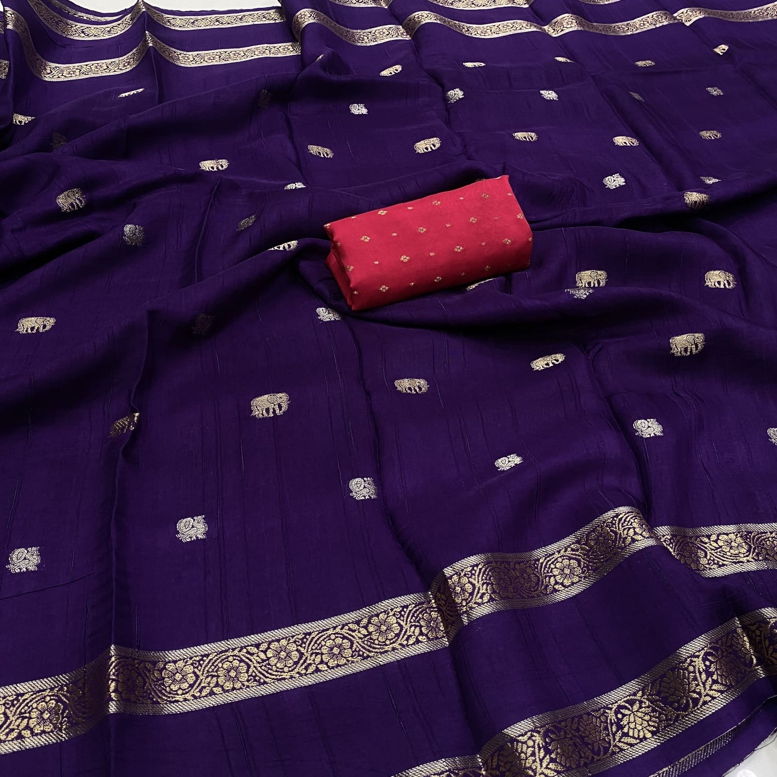 Purple viscose georgette silk saree with elephant annam butta motifs